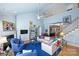 Two-story living room with hardwood floors and a fireplace at 8120 Oratorio Pl, Charlotte, NC 28270