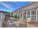 Brick patio with seating area, adjacent to a charming brick home at 8120 Oratorio Pl, Charlotte, NC 28270