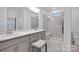 Elegant bathroom with double vanity, large shower, and marble tile at 132 N Shayna Rd, Troutman, NC 28166