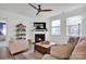 Cozy living room with fireplace and ceiling fan at 132 N Shayna Rd, Troutman, NC 28166