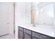 Well-lit bathroom with quartz countertop and gray cabinets, offering a fresh and modern design at 1364 Cedardale Ln, Denver, NC 28037