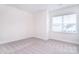 Bright and airy bedroom with neutral carpet and ample natural light from the window at 1364 Cedardale Ln, Denver, NC 28037