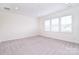 Bright bedroom features neutral carpet, recessed lights, and window offering plenty of natural light at 1364 Cedardale Ln, Denver, NC 28037