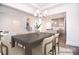 This dining room features an open-concept design with modern lighting and views to the kitchen and staircase at 1364 Cedardale Ln, Denver, NC 28037