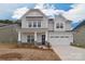 Charming two-story home with stone accents, a covered porch, and a two-car garage at 1364 Cedardale Ln, Denver, NC 28037