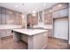 Modern kitchen with a central island, stainless steel appliances, and plenty of cabinet space at 1364 Cedardale Ln, Denver, NC 28037