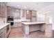 Modern kitchen featuring an island, stainless steel appliances, and elegant pendant lighting at 1364 Cedardale Ln, Denver, NC 28037