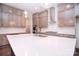 Kitchen island with a sink, quartz countertops, stainless steel appliances, and ample storage at 1364 Cedardale Ln, Denver, NC 28037