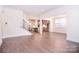 Bright, open-concept living room and kitchen featuring hardwood floors and modern finishes at 1364 Cedardale Ln, Denver, NC 28037