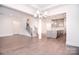Open-concept living space with hardwood flooring, staircase, and modern kitchen at 1364 Cedardale Ln, Denver, NC 28037