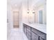 Luxurious bathroom with double vanity, pendant lights, and a large mirror at 1374 Cedardale Ln # 33, Denver, NC 28037