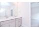 Bright bathroom with a dual sink vanity, light wood cabinets, and a large framed mirror at 1374 Cedardale Ln # 33, Denver, NC 28037