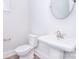 Clean half-bath with modern fixtures, including a pedestal sink and elongated toilet at 1374 Cedardale Ln # 33, Denver, NC 28037