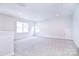 Spacious bonus room with neutral carpeting, recessed lighting, and ample natural light at 1374 Cedardale Ln # 33, Denver, NC 28037