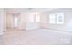 Large bonus room with neutral carpeting and plenty of natural light at 1374 Cedardale Ln # 33, Denver, NC 28037