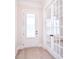 Bright entryway featuring a white front door, glass french doors and wood-look flooring at 1374 Cedardale Ln # 33, Denver, NC 28037