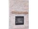 Stone fireplace featuring a wooden mantel and a black firebox insert adding warmth and charm at 1374 Cedardale Ln # 33, Denver, NC 28037
