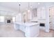 Modern kitchen with stainless steel appliances, spacious island, stone fireplace and pendant lighting at 1374 Cedardale Ln # 33, Denver, NC 28037