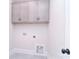 Well-lit laundry room with overhead cabinets, and utility hookups for washer and dryer at 1374 Cedardale Ln # 33, Denver, NC 28037