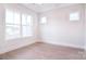 Bright living room featuring large windows and wood-look flooring at 1374 Cedardale Ln # 33, Denver, NC 28037
