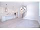 Open floor plan showcasing the kitchen, staircase, and living room with natural light at 1374 Cedardale Ln # 33, Denver, NC 28037
