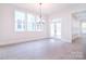 Bright and airy living space with large windows, a chandelier, and hardwood floors at 1374 Cedardale Ln # 33, Denver, NC 28037
