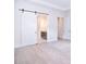 Open view from living room to ensuite bath featuring sliding barn door at 1374 Cedardale Ln # 33, Denver, NC 28037