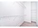 Bright walk-in closet with wire shelving, providing ample storage space and organization at 1374 Cedardale Ln # 33, Denver, NC 28037