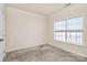Simple bedroom with neutral walls, carpeting, and window at 1485 Adkin Dr, Iron Station, NC 28080