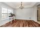 Bright dining room with hardwood floors and a chandelier at 1485 Adkin Dr, Iron Station, NC 28080