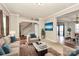 Inviting living room with plush seating, neutral colors, and seamless flow to the dining area at 1485 Adkin Dr, Iron Station, NC 28080