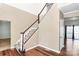 Elegant staircase with wooden handrail leading to the upper level at 1485 Adkin Dr, Iron Station, NC 28080