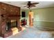 Living room with a brick fireplace and built-in shelving at 155 Stanwyck Rd, Salisbury, NC 28147