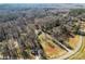 Expansive aerial view of a property with mature trees and a long driveways at 1769 Old Nc 27 Hwy, Mount Holly, NC 28120