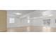 Bright, unfinished basement with walk-out access offers a blank canvas for customization and expansion at 1769 Old Nc 27 Hwy, Mount Holly, NC 28120