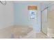 Bathroom with corner bathtub, shower stall, and window at 1769 Old Nc 27 Hwy, Mount Holly, NC 28120