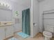 Bathroom featuring a shower, vanity with sink, and practical storage solutions at 1769 Old Nc 27 Hwy, Mount Holly, NC 28120