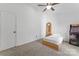 Bright bedroom features a ceiling fan, carpet flooring, and vintage PacMan arcade game at 1769 Old Nc 27 Hwy, Mount Holly, NC 28120