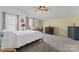 Bedroom with carpeted floor, ceiling fan, and two large windows at 1769 Old Nc 27 Hwy, Mount Holly, NC 28120