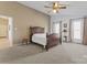 Spacious bedroom with carpeted floor, ceiling fan, and window views at 1769 Old Nc 27 Hwy, Mount Holly, NC 28120