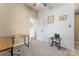 Neutral-toned bedroom with carpet flooring, writing desk, and multiple wall decorations at 1769 Old Nc 27 Hwy, Mount Holly, NC 28120
