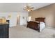 Main bedroom with carpeted floors, ceiling fan, and ample closet space at 1769 Old Nc 27 Hwy, Mount Holly, NC 28120