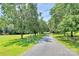 Gravel driveway leading through property to home at 1769 Old Nc 27 Hwy, Mount Holly, NC 28120