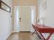 Bright entryway with red console table and wood floors at 1769 Old Nc 27 Hwy, Mount Holly, NC 28120