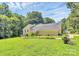 Side view of home on a green lawn and beautiful landscaping at 1769 Old Nc 27 Hwy, Mount Holly, NC 28120