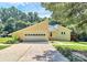 Shot of the exterior of the house with a garage and a well-maintained yard at 1769 Old Nc 27 Hwy, Mount Holly, NC 28120