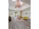 Bright and airy living room with vaulted ceilings, skylight, and stylish decor, creating an inviting atmosphere at 1769 Old Nc 27 Hwy, Mount Holly, NC 28120