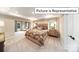 Comfortable bedroom with sitting area and window views at 2019 Canvasback Way, Indian Trail, NC 28079