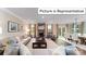 Open living room with fireplace and adjacent dining area at 2019 Canvasback Way, Indian Trail, NC 28079