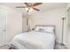 Well-lit bedroom with a queen bed and floor lamp at 226 J.P. Dr, Albemarle, NC 28001